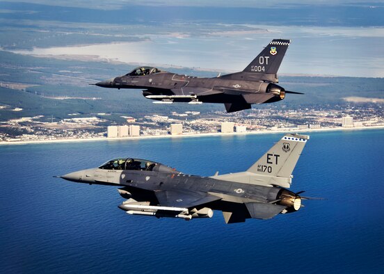 F-16 Fighting Falcons from the 40th Flight Test Squadron and 85th Test and Evaluation Squadron fly over the Emerald Coast Dec. 6 on a design-try-out mission for a new operational flight program software upgrade. The newest OFP for Block 40 and 50 model F-16s will be tested developmentally and operationally at Eglin Air Force Base, Fla., in 2014. This marks the first time ever an F-16 OFP has undergone developmental and operational testing in the same location. (Courtesy photo)
