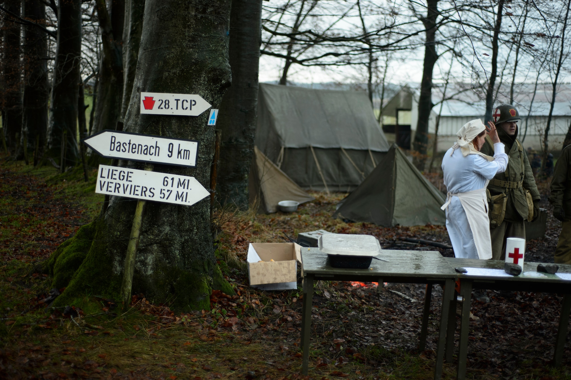BASTOGNE, Belgium – Reenactors set up camp along the Bastogne Historic Walk route where U.S. forces defended against the German advance in December 1944. While some participants opt to stay in a hotel for the weekend, others decide to brave the frosty winter nights by camping outdoors. (U.S. Air Force photo by Staff Sgt. Nathanael Callon/Released)