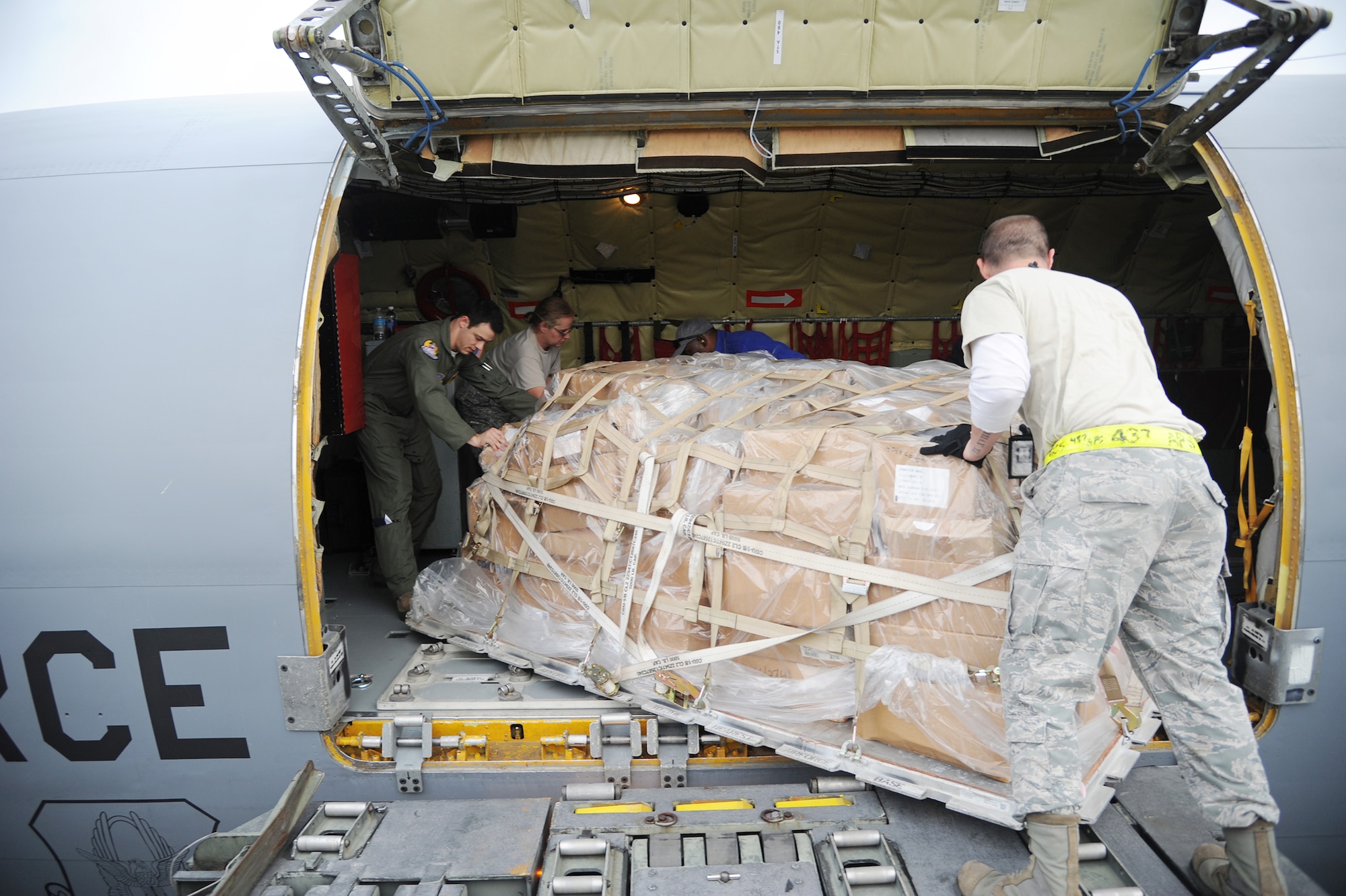 A team of Airmen from MacDill Air Force Base, Florida and Charleston Air Force Base, S.C, load a pallet of humanitarian cargo on a KC-135 at Charleston Air Force Base, S.C, December 13, 2012. The cargo was transported by a team of Airmen from MacDill Air Force Base for an Air Force Reserve training mission as part of the Denton Program, a program that allows military aircraft to transport aid supplies on a space-available basis. (U.S. Air Force photo by Staff Sgt. Jennie Chamberlin)