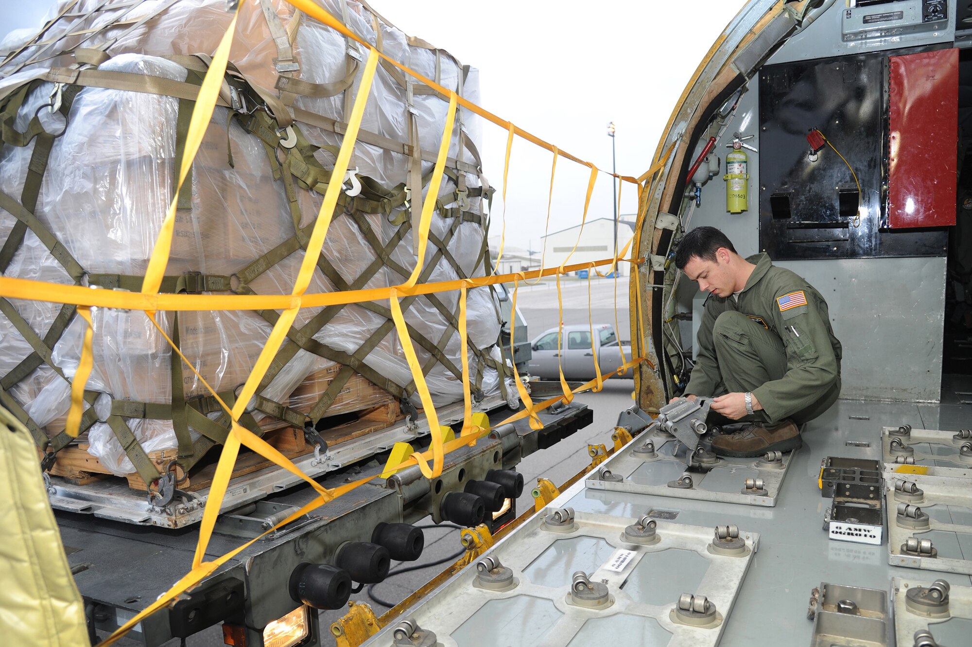 Senior Airman Mike Dunn, 91st Air Refueling Squadron, prepares to load a pallet of humanitarian cargo on a KC-135 at Charleston Air Force Base, S.C, December 13, 2012. The cargo was transported by a team of Airmen from MacDill Air Force Base for an Air Force Reserve training mission as part of the Denton Program, a program that allows military aircraft to transport aid supplies on a space-available basis. (U.S. Air Force photo by Staff Sgt. Jennie Chamberlin)