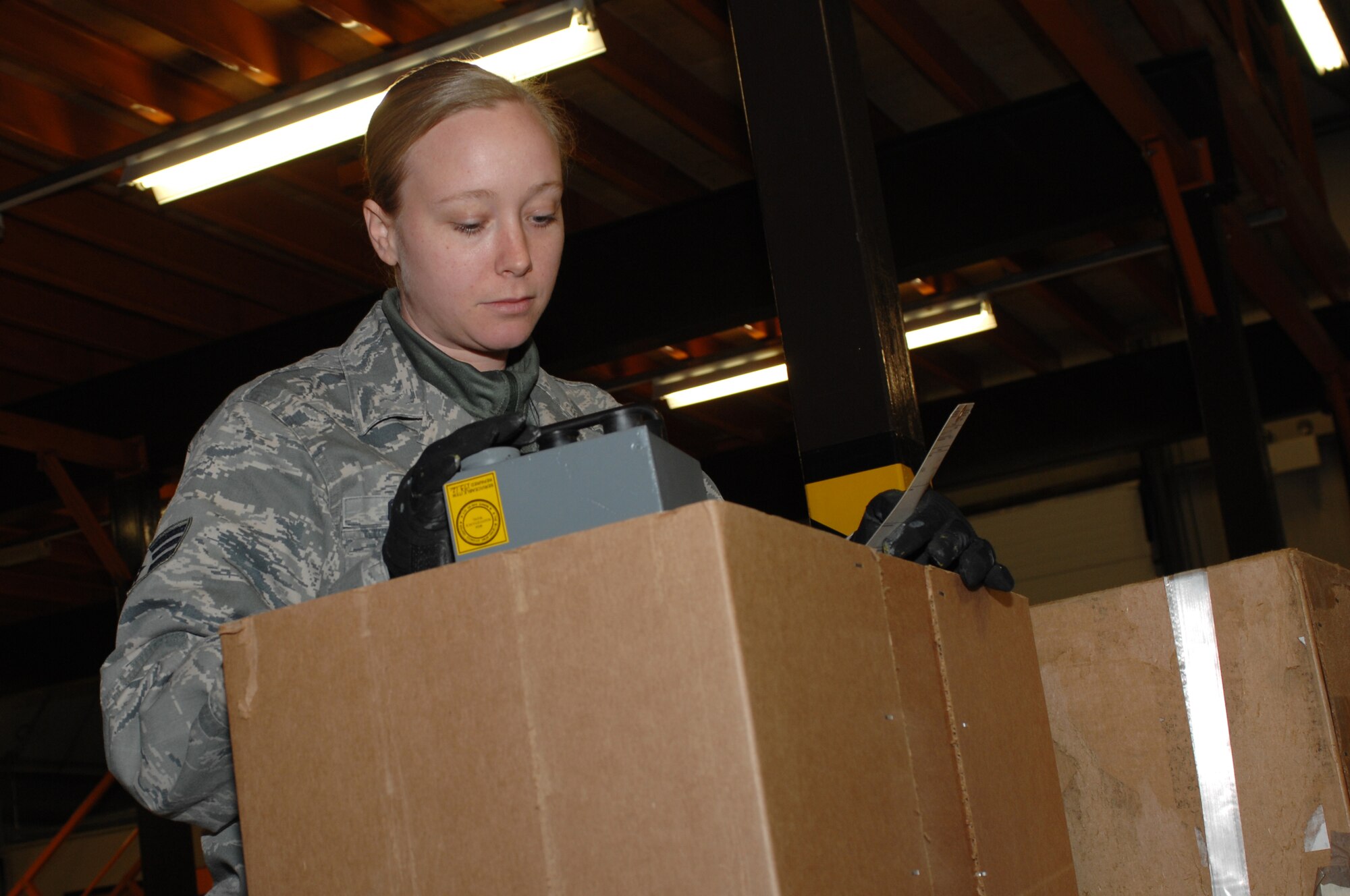 ROYAL AIR FORCE LAKENHEATH, England -- Senior Airman Jennifer Cathey, 48th Logistics Readiness Squadron flight service center journeyman, checks over an aircraft asset turn-in Dec. 18, 2012. Cathey was nominated for a Liberty Spotlight because she displays the core value of "Excellence in All We Do." (U.S. Air Force photo by Airman 1st Class Dana J. Butler)

