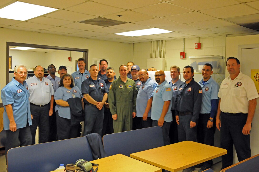 The 47th Maintenance Directorate, T-6 maintenance support unit, poses with Col. Tom Murphy, 47th Flying Training Wing commander after being presented the XLer of the week award at Laughlin Air Force Base, Texas, Dec. 5, 2012. The XLer is a weekly award chosen by wing leadership and given to those who consistently make outstanding contributions to Laughlin and their unit. (U.S. Air Force photo/Senior Airmen Scott Saldukas)