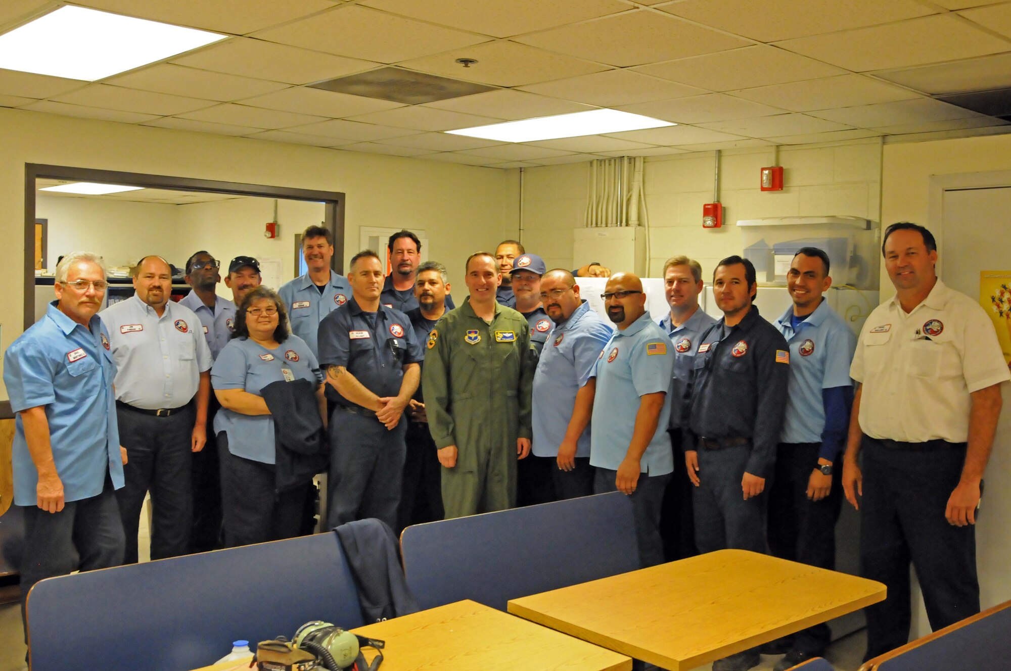 The 47th Maintenance Directorate, T-6 maintenance support unit, poses with Col. Tom Murphy, 47th Flying Training Wing commander after being presented the XLer of the week award at Laughlin Air Force Base, Texas, Dec. 5, 2012. The XLer is a weekly award chosen by wing leadership and given to those who consistently make outstanding contributions to Laughlin and their unit. (U.S. Air Force photo/Senior Airmen Scott Saldukas)