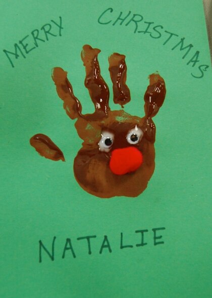Natalie Rock took some time to make art-work of Santa's
Reindeer at the USAFCENT Children's holiday party December 13 at Shaw AFB,
S.C. (U.S. Air Force photo by USAFCENT Public Affairs/Released)
