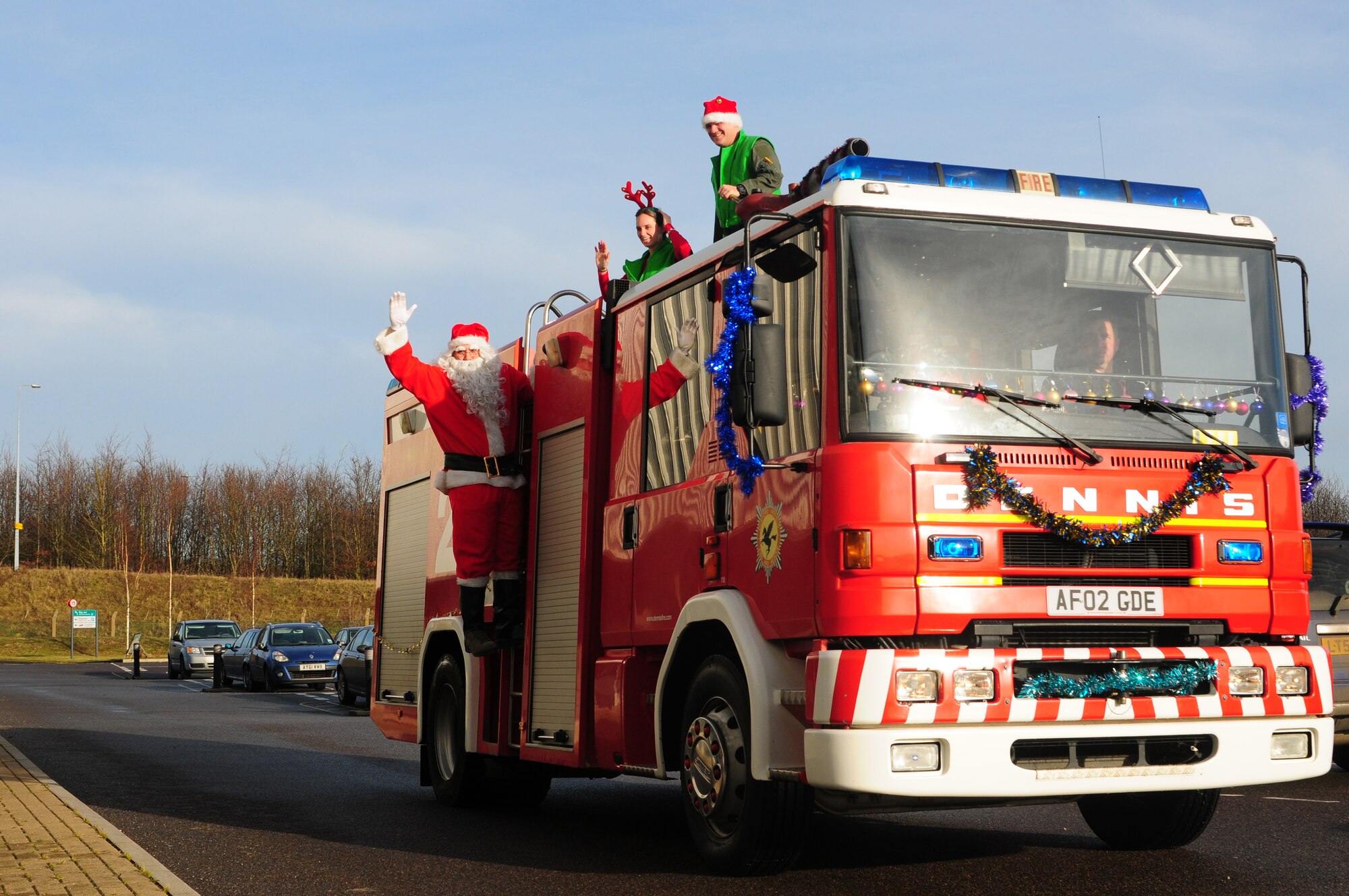 DUXFORD IMPERIAL WAR MUSEUM, England – Santa Claus and his elves arrive by fire truck during a children’s Christmas party at the Duxford Imperial War Museum Dec. 15, 2012. The 492nd Fighter Squadron hosted this year’s annual children’s Christmas party, which was attended by more than 40 children including many from U.K. hospitals. (U.S. Air Force photo by Airman 1st Class Cory D. Payne)