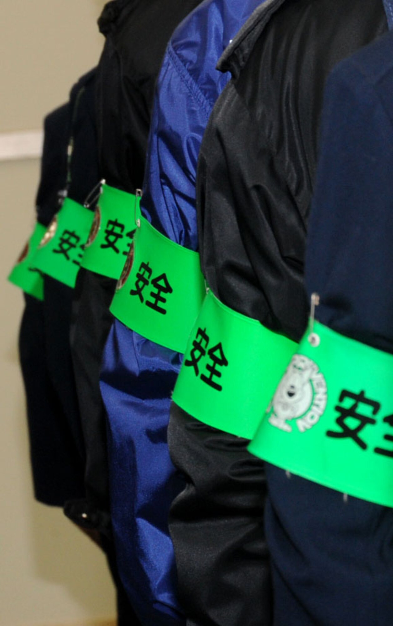 Members of the Misawa safety patrol wear a green reflective armband, which reads ‘safety’ in Kanji, so the local community would be able to spot them in the dark out in Misawa City, Japan, Dec. 17, 2012. Several organizations, including Misawa’s Police Force and Misawa Air Base leadership participated at the campaign. (U.S. Air Force photo by Airman 1st Class Kenna Jackson)