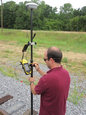 Jeremy Beasley, ERDC Geotechnical and Structures Laboratory, works with the Electronic Railroad Inspection Database System hardware. 