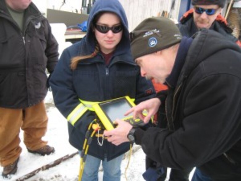 Alaska Clean Seas (ACS) Instructor Chris Hall provides guidance on the monitoring of oil under ice using ground penetrating radar during the field practical portion &quot;Advanced Ice Safety and Response&quot; training hosted recently at CRREL. 