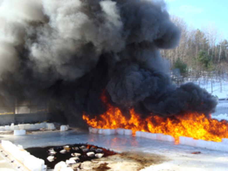 Image above shows burning of oil collected in a recovery trench. In the foreground, oil residue in broken ice is visible in the pit from previous burn. This is an accepted and extremely efficient method of mitigating oil spills in ice-infested waters. 