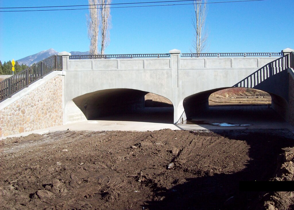 FLAGSTAFF, Ariz. -- The U.S. Army Corps of Engineers Los Angeles District completed construction on a new bridge across Thorpe Rd which more than triples the flow capacity in the area. The "classic-looking" bridge project also contains retaining walls and the wing walls with a malapai rock veneer to provide aesthetic enhancement to the flood risk management project. 