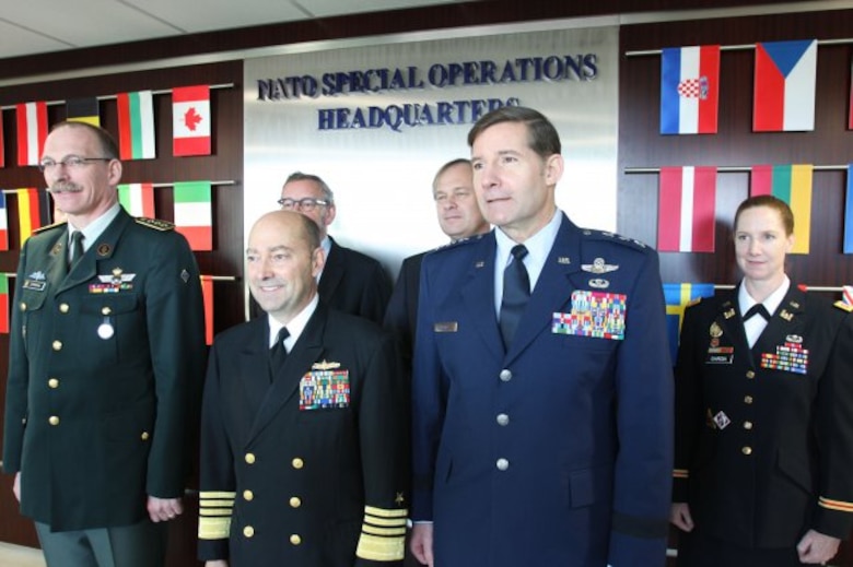 NATO special operations forces, comprised of 26 member nations and three non-NATO partners, celebrate the completion of a new state-of-the-art, 23,000-square-foot headquarters building during a ribbon-cutting ceremony Dec. 12 at SHAPE in Mons, Belgium. NATO's Supreme Allied Commander Europe, Adm. James Stavridis, center left, and Lt. Gen. Frank Kisner, NATO Special Operations Headquarters commander, addressed distinguished guests and expressed their desire for the building to serve as an ideas hub for 21st-century special operations.