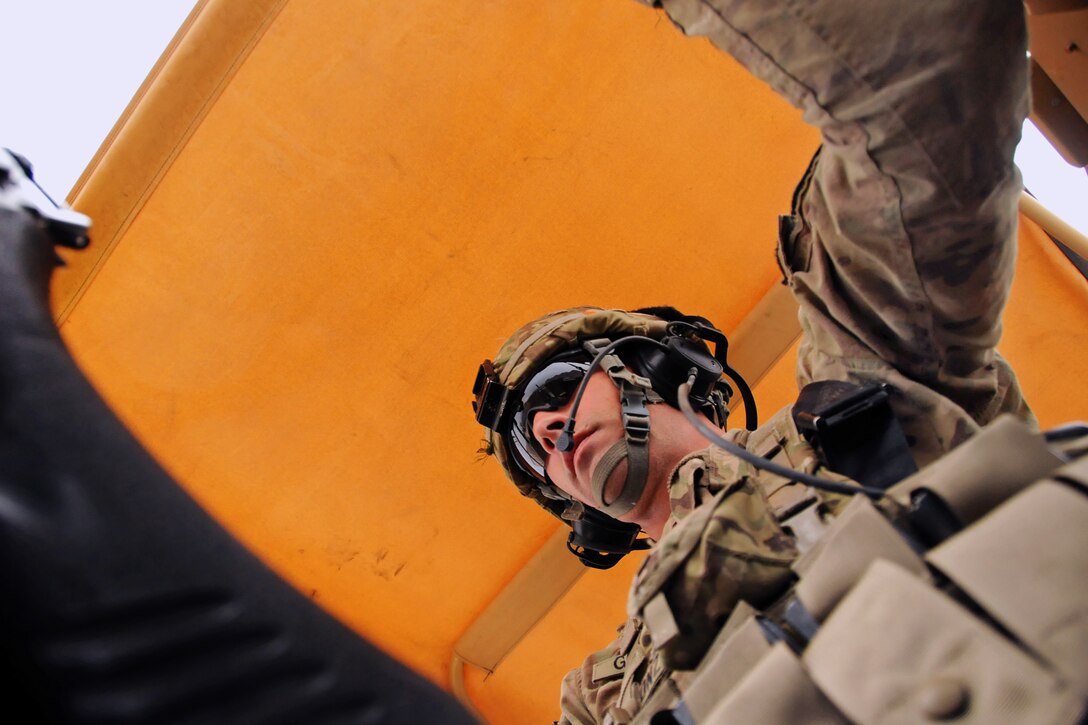 U.S. Army Spc. Joseph Gonzalez maintains a watchful eye during a mounted patrol to Camp Sayar for a security transition ceremony in Farah City, Afghanistan, Dec. 12, 2012. Gonzalez, a gunner, is assigned to Provincial Reconstruction Team Farah.