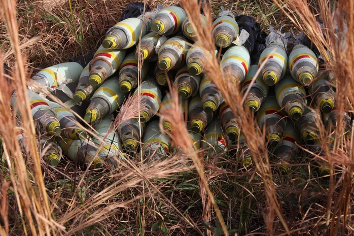 A pile of 81 mm mortar rounds rest on a demolition range during a demolition conducted by Ammunition Company, 2nd Supply Battalion, 2nd Marine Logistics Group aboard Camp Lejeune, N.C., Dec. 4, 2012. The event challenged the company’s Marines to anticipate the various risks associated with destroying obsolete ammunition as they prepped the mortars and other ordnance for destruction.