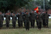 Marines of Combat Logistics Regiment 2, 2nd Marine Logistics Group salute as the colors march onto the parade deck during an appointment and relief ceremony aboard Camp Lejeune, N.C., Dec. 11, 2012.  During the ceremony, Sgt. Maj. Anthony L. Crutcher passed the Sword of Office to Sgt. Maj. Lanette N. Wright. 