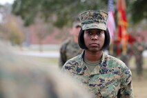 Sgt. Maj. Lanette N. Wright, the incoming sergeant major of Combat Logistics Regiment 2, 2nd Marine Logistics Group, awaits the passing of the Sword of Office during an appointment and relief ceremony aboard Camp Lejeune, N.C., Dec. 11, 2012.  Wright, who came to CLR-2 from Combat Logistics Regiment 27, will deploy with the unit in the beginning of 2013. 