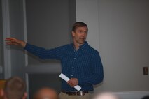 Craig E. Ten Brink, a Glen Rock, N.J., native, and the base threatened and endangered species program manager, discusses the negative impact humans can have on the environment during a training seminar with 2nd Marine Logistics Group aboard Camp Lejeune, N.C., Dec. 5, 2012. Ten Brink cautioned the Marines to dispose of waste the proper way and to watch out for fellow servicemembers’ recycling habits.  