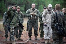 Capt. Kyle L. Schull (left), the commander of Transportation Support Company, Combat Logistics Battalion 6, 2nd Marine Logistics Group, gives the Marines instructions for a convoy during a three-day field exercise aboard Camp Lejeune, N.C., Dec. 11-13, 2012. Servicemembers with the battalion received classes and performed convoy missions in preparation of a future deployment.