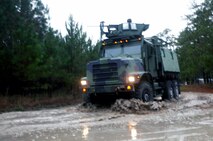 Marines with Combat Logistics Battalion 6, 2nd Marine Logistics Group drive a Medium Tactical Vehicle Replacement through rough terrain during a three-day field exercise aboard Camp Lejeune, N.C., Dec. 11-13, 2012. Servicemembers with the battalion received classes during their field exercise on vehicle check points, loading and unloading trailers, maneuvering trailers, and crew-served weapon assembly and disassembly.