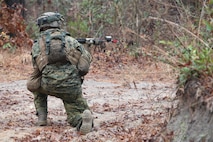 A Marine with 8th Engineer Support Battalion, 2nd Marine Logistics Group provides cover as his platoon crosses an intersection during its dismounted patrol training aboard Camp Lejeune, N.C., Dec. 13, 2012. The platoon established a hasty ambush near the intersection, where a rolling battle with a rival platoon broke out several minutes later. 