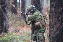 A Marine with 8th Engineer Support Battalion engages a rival platoon of Marines during an ambush at the unit’s training site board Camp Lejeune, N.C., Dec. 13, 2012. The Marines spent three days patrolling the area and conducting reconnaissance and resupply missions designed to prepare them to work with dismounted combat troops in the field.