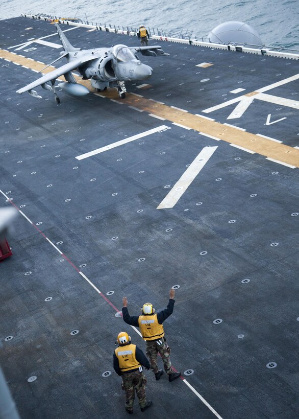 An AV-8B Harrier assigned to Marine Medium Tiltrotor Squadron (VMM) 266 Reinforced, 26th Marine Expeditionary Unit (MEU), prepares to takeoff from the flight deck of the USS Bataan (LHD 5) off the coast of North Carolina, Dec. 15, 2012. The touch and go landings were a part of the unit's qualifications required for deployment. The 26th MEU operates continuously across the globe, providing the president and unified combatant commanders with a forward-deployed, sea-based quick reaction force. The MEU is a Marine Air-Ground Task Force capable of conducting amphibious operations, crisis response, and limited contingency operations. The 26th MEU is slated to deploy in 2013. (U.S. Marine Corps photo by Cpl. Christopher Stone/Released)
