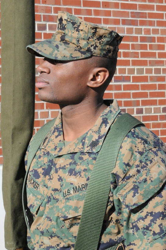 MARINE CORPS BASE QUANTICO, Va. – Sgt. Alex Tucker, base color sergeant, Ceremonial Platoon, holds onto a sheathed American flag before a practice session. Tucker, a Philadelphia native, is Quantico’s 13th color sergeant since 1999.