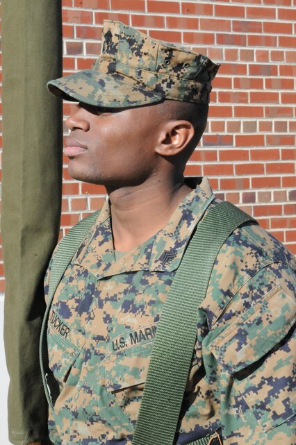 MARINE CORPS BASE QUANTICO, Va. – Sgt. Alex Tucker, base color sergeant, Ceremonial Platoon, holds onto a sheathed American flag before a practice session. Tucker, a Philadelphia native, is Quantico’s 13th color sergeant since 1999.