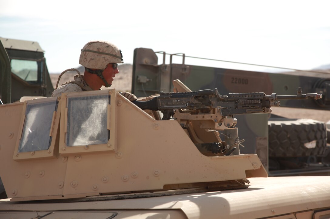 Marines with Combat Logistics Battalion 5, Combat Logistics Regiment 1, 1st Marine Logistics Group, halt during a training scenario at Marine Corps Air Ground Combat Center Twentynine Palms, Calif., Dec. 14. Marines with CLB-5 supported Regimental Combat Team 5 during Exercise Steel Knight, a combined arms exercise aboard both Camp Pendleton and Twentynine Palms.