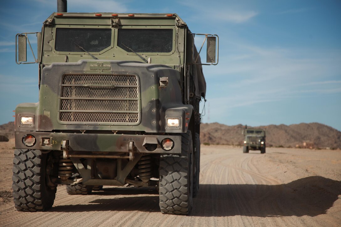Marines with Combat Logistics Battalion 5, Combat Logistics Regiment 1, 1st Marine Logistics Group, halt during a training scenario at Marine Corps Air Ground Combat Center Twentynine Palms, Calif., Dec. 14. Marines with CLB-5 supported Regimental Combat Team 5 during Exercise Steel Knight, a combined arms exercise aboard both Camp Pendleton and Twentynine Palms.