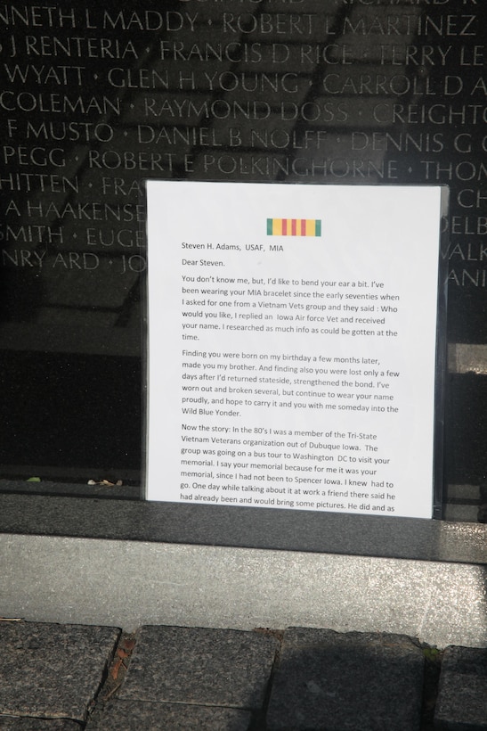 Visitors leave flags, letters and other mementos at the foot of the Vietnam Memorial in Washington D.C. Nov. 10. After so long the mementos are taken and placed in a museum that houses all the things left at the wall.