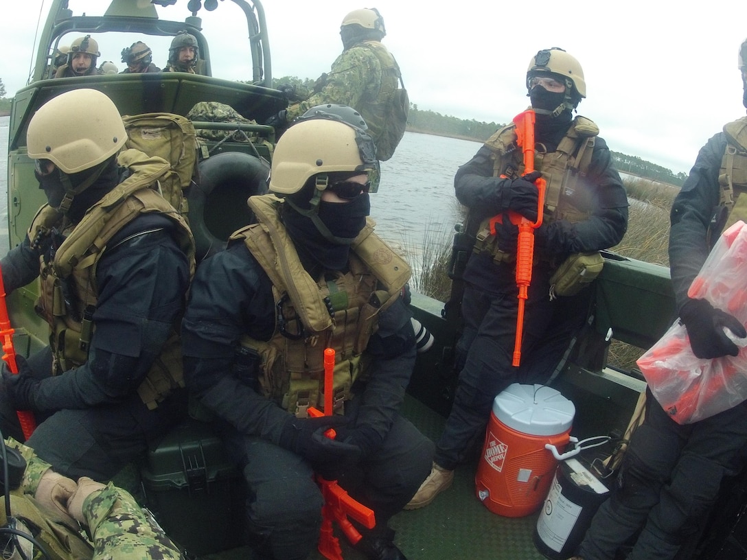 Sailors with Navy Riverine Squadron 2, Detachment 22, extract from simulated enemy territory during a training exercise in the Cherry Point area. The boat team conducted several training exercises on the waterways surrounding Marine Corps Outlying Field Atlantic and Cherry Point during their trip here from Little Creek, Va., Dec. 10-14.