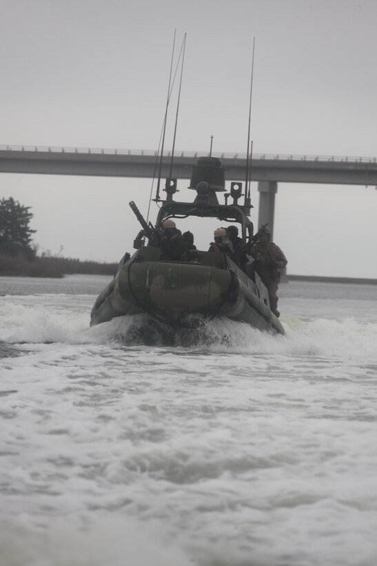 Sailors with Naval Riverine Squadron 2 visiting Cherry Point, race down a nearby waterway, Dec. 12. 