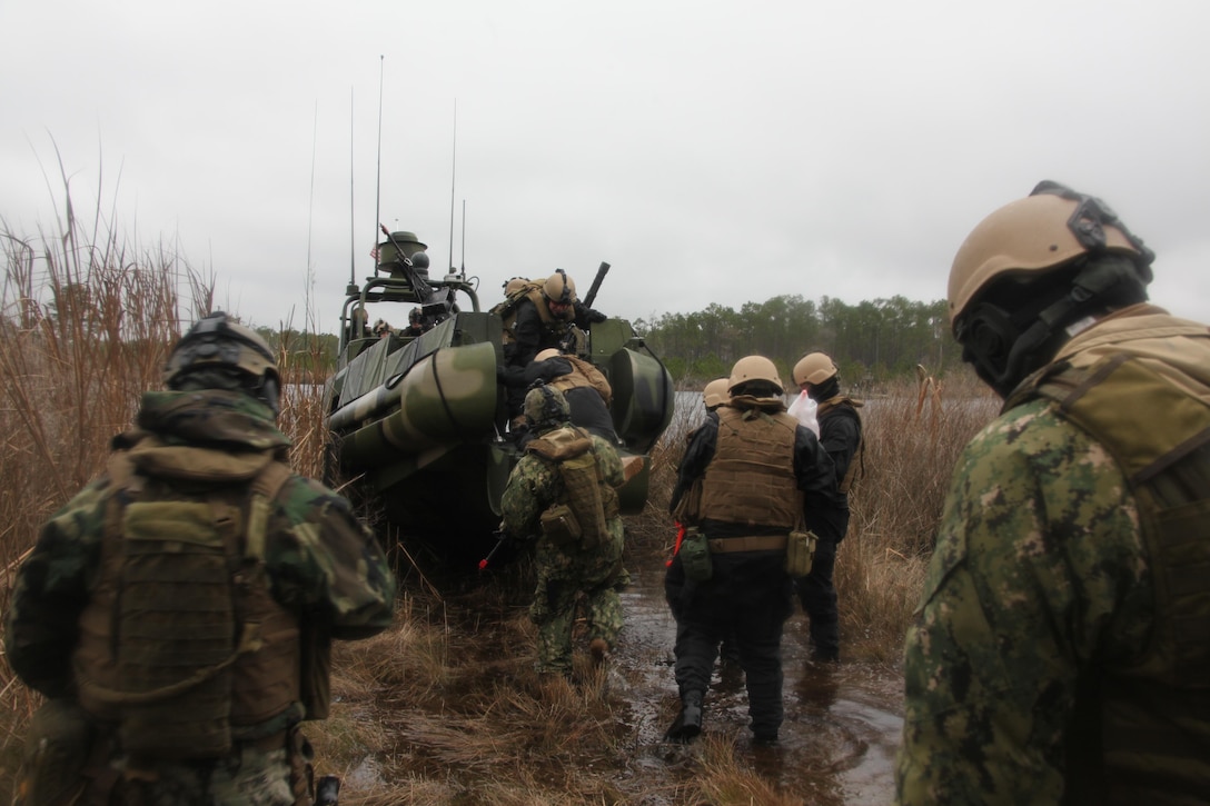 Sailors with Navy Riverine Squadron 2, Detachment 22, extract from simulated enemy territory during a training exercise in the Cherry Point area. The boat team conducted several training exercises on the waterways surrounding Marine Corps Outlying Field Atlantic and Cherry Point during their trip here from Little Creek, Va., Dec. 10-14.