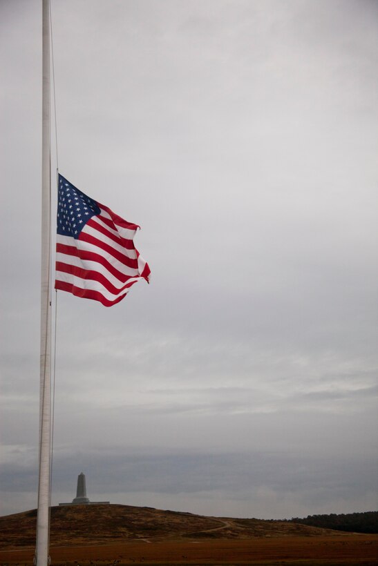 A flag flies at half-staff in honor of the victims of the shooting at Sandy Hook Elementary School in Newtown, Conn., as the National Wright Brothers Memorial looms in the background on the 109th anniversary of the first powered flight, Dec. 17 at Kitty Hawk, N.C. On that date 109 years ago, aviation became a reality when Orville Wright flew in a machine heavier than air for 12 seconds.
