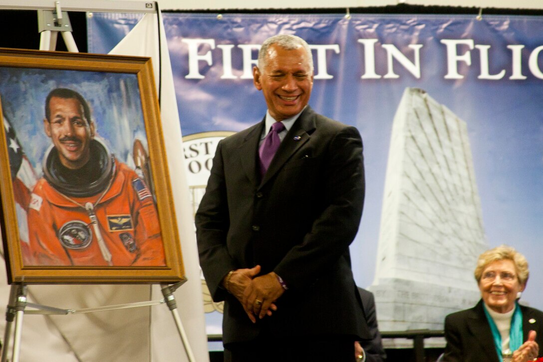 Retired Maj. Gen. Charles F. Bolden Jr. smiles as he sees his official portrait as part of his induction into the First Flight Society's Paul E. Garber First Flight Shrine in Kitty Hawk, N.C., Dec. 17, the 109th anniversary of the first powered flight. Bolden's remarkable career includes flying more than 100 combat sorties in the Vietnam War, serving as an astronaut, where he flew four times in the space shuttle, serving as commanding general of the 3rd Marine Aircraft Wing, and now heading NASA, where he oversaw the conclusion of the space shuttle program and the successful launch of a vehicle on Mars.
