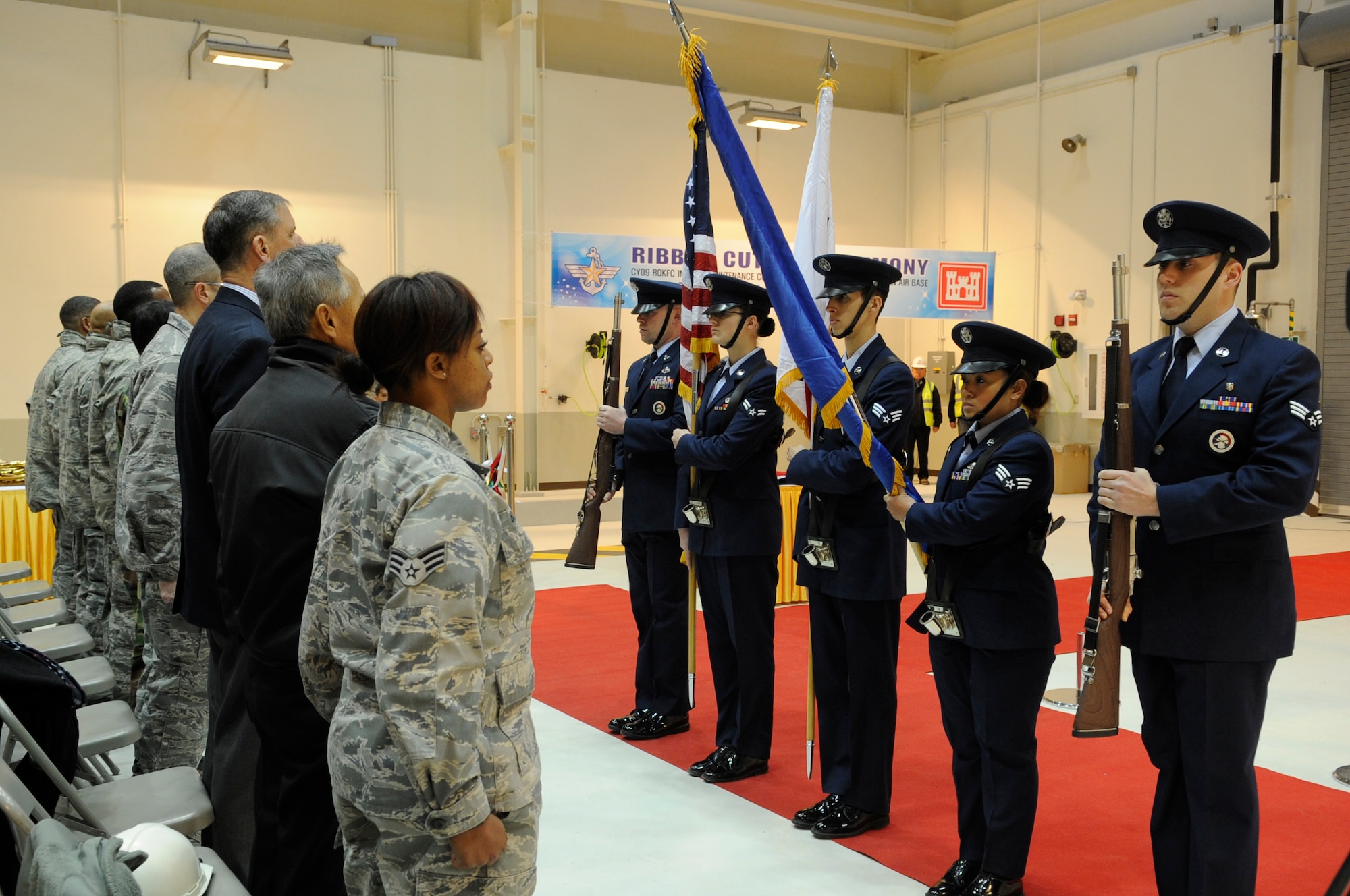 The Kunsan Air Base Honor Guard posts the colors during a ribbon-cutting ceremony for the new 8th Maintenance Squadron accessory shop Dec. 18, 2012, at Kunsan AB, Republic of Korea. The new facility consolidates four functional areas: wheel and tire, hydraulics and electrical, external tank and the commander support staff. (U.S. Air Force photo by Senior Airman Brigitte N. Brantley/Released)