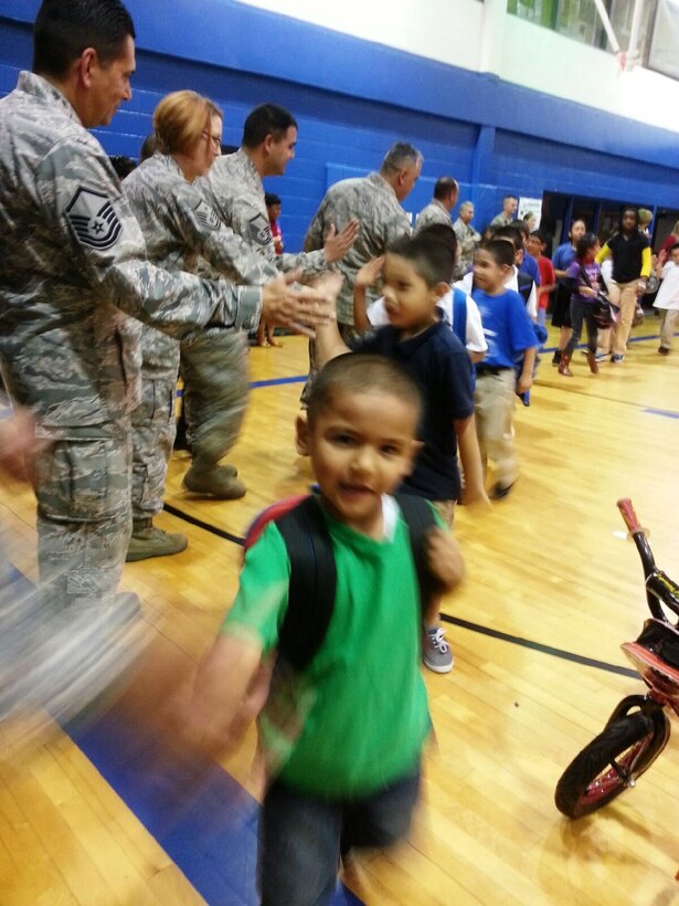 Boys and Girls Club's members from San Antonio, Texas were welcomed by 433rd Airlift Wing members to the Calderon Branch of the Boys and Girls Club of San Antonio. "This may be the only gift these boys and girls get for Christmas. To see the excitement on their faces when they come in a see these bikes, it lets them know there truly is a Santa," Chief Master Sgt. Daniel Martinez, 26 Aerial Port Squadron said. (U.S. Air Force photo/ Tech Sgt. Carlos J. Trevino)