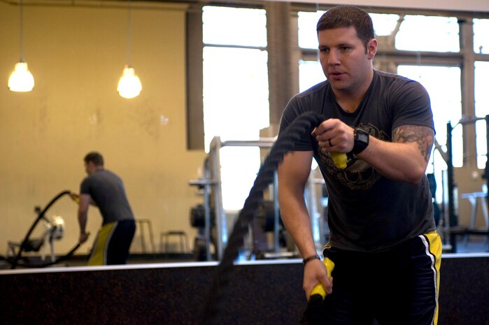 Senior Airman Troy Lee, 99th Force Support Squadron intramural sports director, works out at the Warrior Fitness Center Dec. 19, 2012, at Nellis Air Force Base, Nev. The Warrior Fitness Center will have reduced hours from Dec. 24 to Jan. 1. The facility will be open from 8 a.m. until 5 p.m. during these dates. (U.S. Air Force photo by Airman 1st Class Christopher Tam)