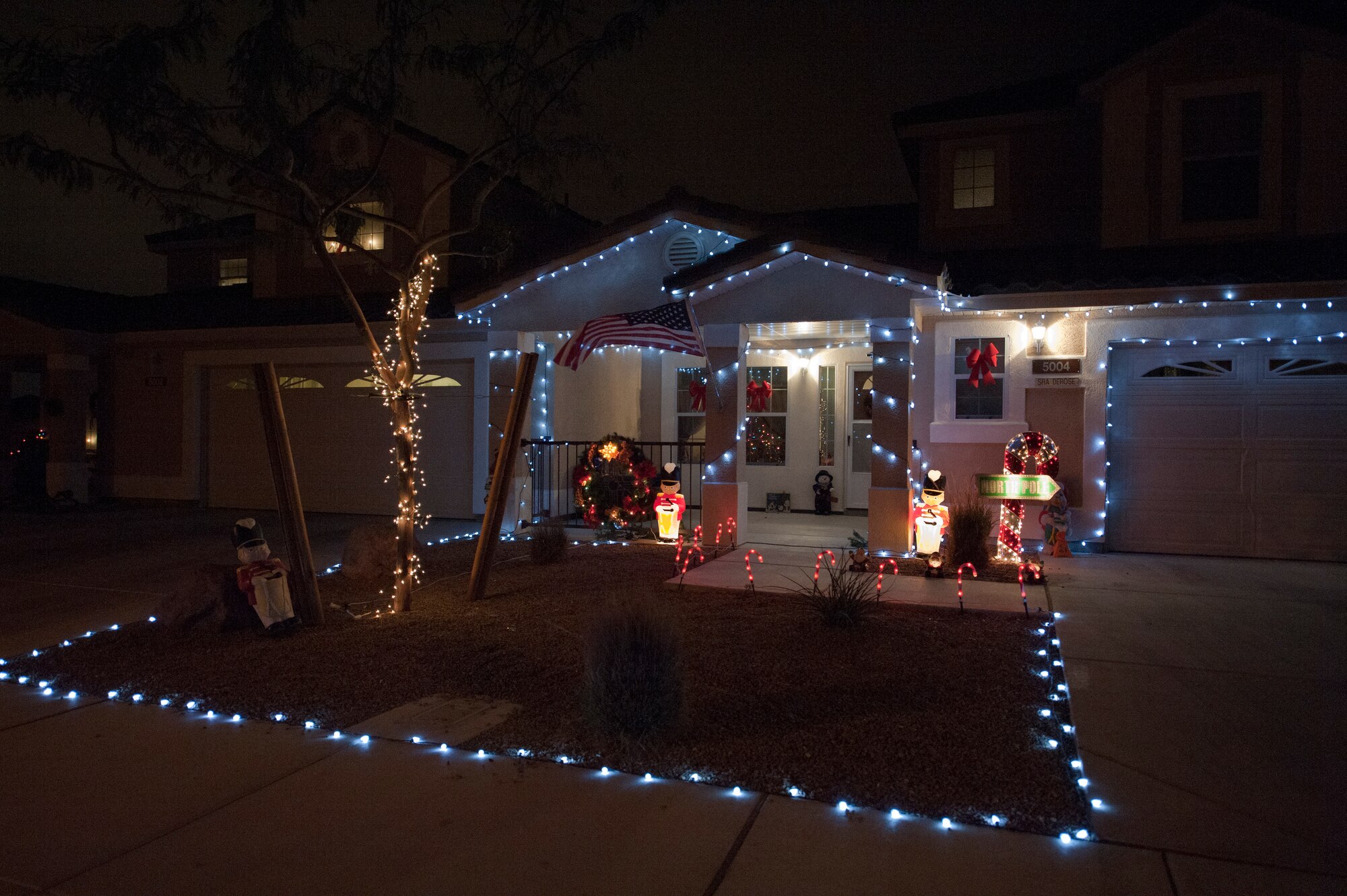 Nellis Air Force Base housing is lit up for the holiday season Dec. 17, 2012. Celebrate this holiday season with a lights tour around base. Some of the houses have gone all out to bring some holiday cheer. (U.S. Air Force photo by Caitlin Kenney)
