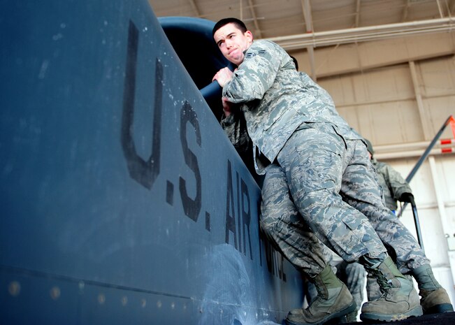 Airman 1st Class Joshua Wieringa, 9th Aircraft Maintenance Squadron crew chief, adjusts the forward nacelle air intake on an Air Force RQ-4 Global Hawk intelligence, surveillance and reconnaissance aircraft Dec. 19, 2012, at Beale Air Force Base, Calif. (U.S. Air Force photo by Senior Airman Shawn Nickel/Released)