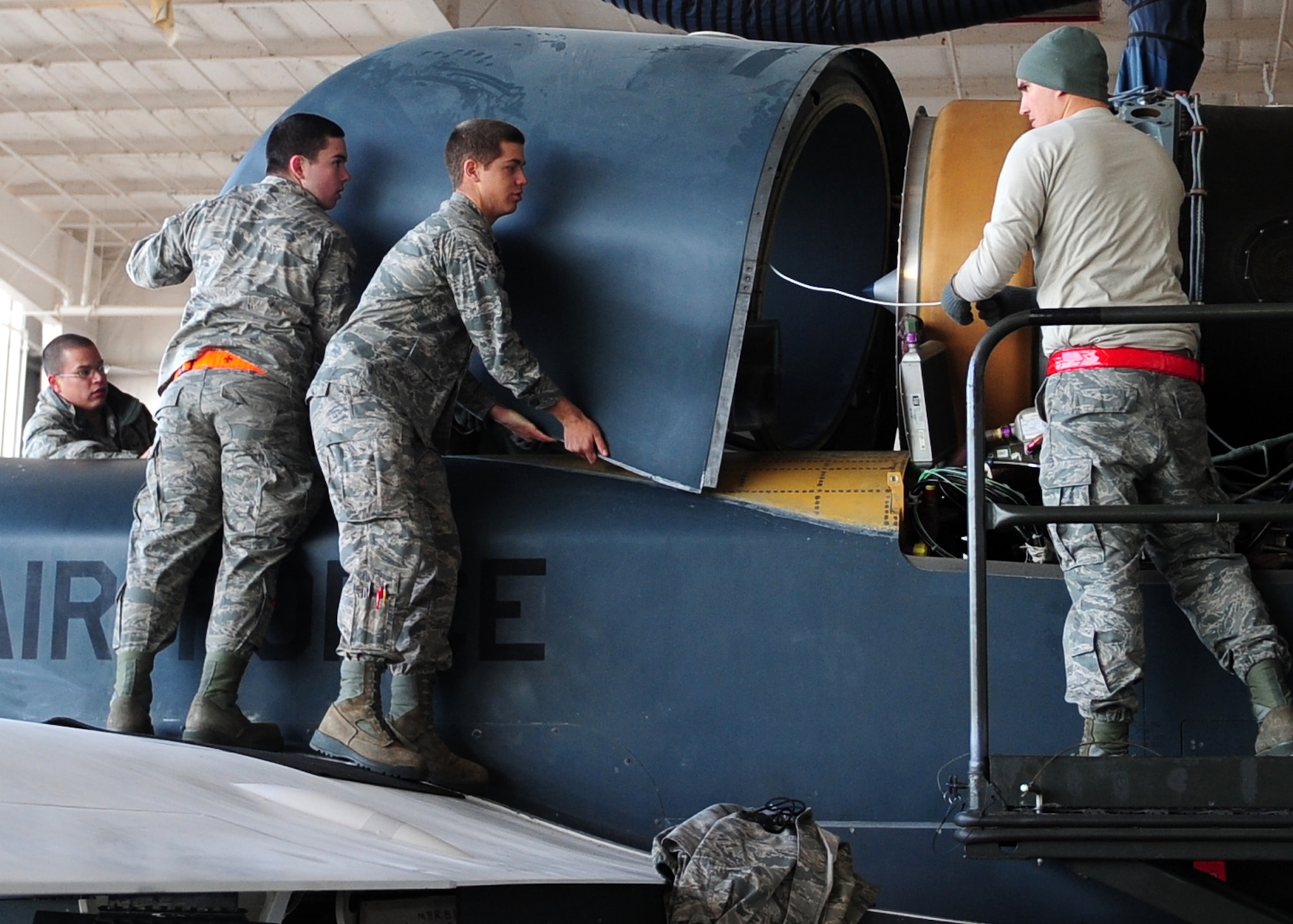 Airmen from the 9th Aircraft Maintenance Squadron place the forward nacelle air intake on an Air Force RQ-4 Global Hawk intelligence, surveillance and reconnaissance aircraft Dec. 19, 2012, at Beale Air Force Base, Calif. The part was repaired off the aircraft to ensure no dust or debris damaged internal parts. (U.S. Air Force photo by Senior Airman Shawn Nickel/Released)