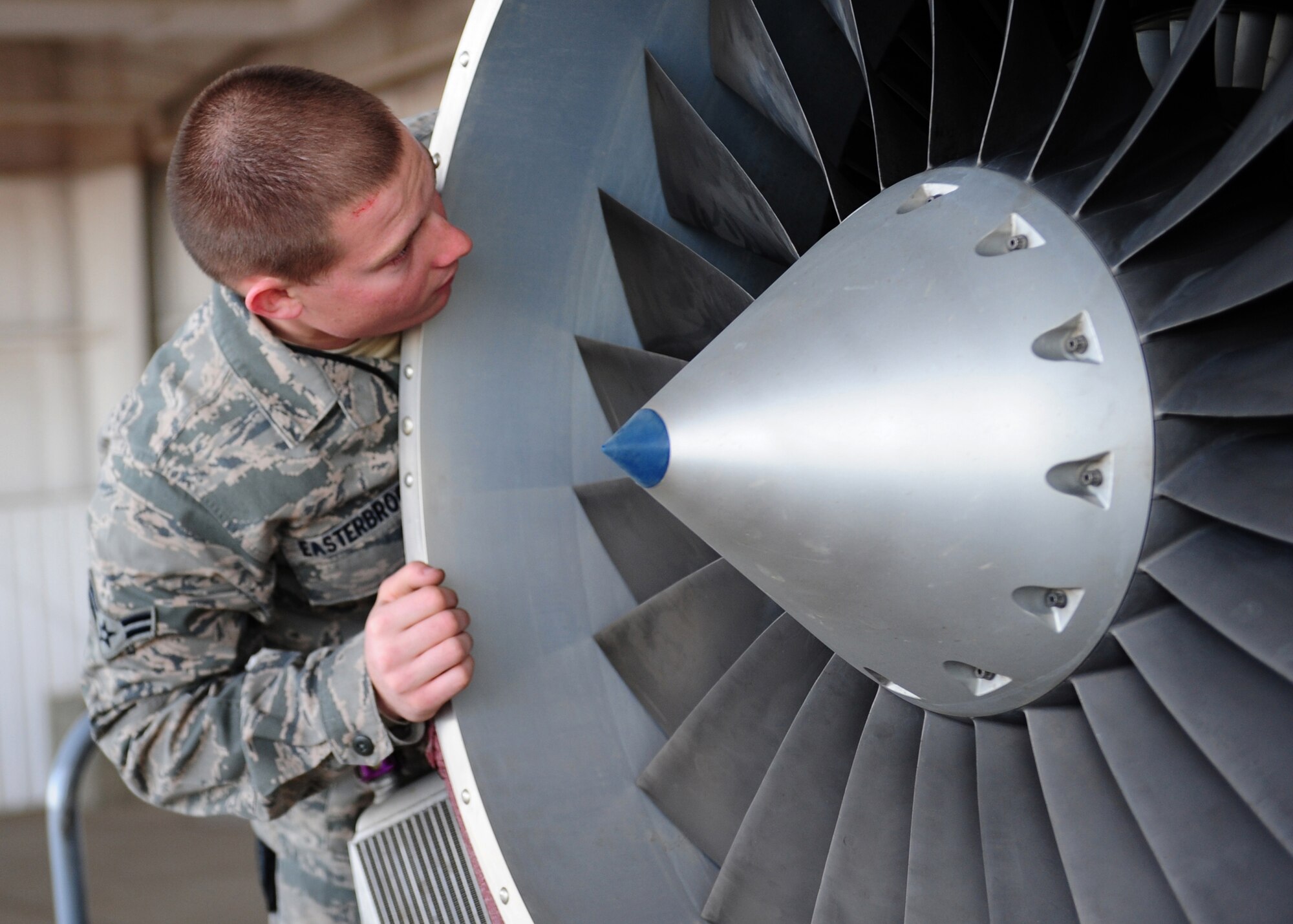 Airman 1st Class Bradley Easterbrook, 9th Aircraft Maintenance Squadron crew chief, checks the turbine blades on an Air Force RQ-4 Global Hawk intelligence, surveillance and reconnaissance aircraft Dec. 19, 2012, at Beale Air Force Base, Calif. Airmen check for foreign objects that can damage internal parts before re-assembling the aircraft during maintenance. (U.S. Air Force photo by Senior Airman Shawn Nickel/Released)