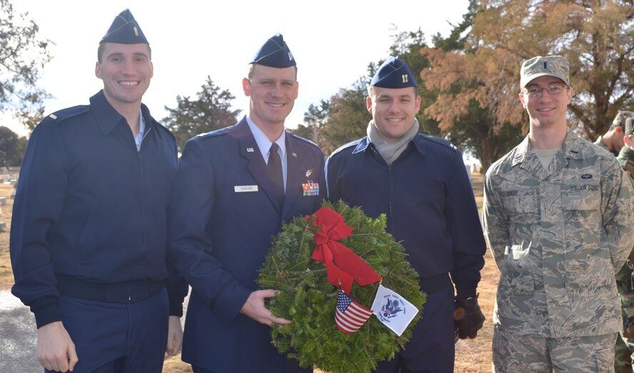 Capt Brian Nicholas, Capt Ryan Yingling, 1Lt T. Woody Sukut and 2Lt Scott
Neidrick participated in the Wreaths Across America ceremony on Dec. 15 at
the Eastview Cemetery in Vernon, Tx. The event was part of a national
campaign to honor those who serve and remember the fallen heroes. (Courtesy
Photo)
