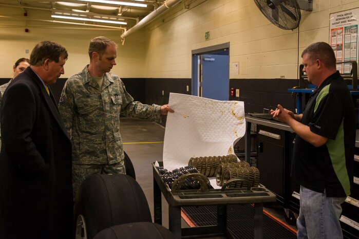 Tech. Sgt. Kevin Long, 437th Maintenance Squadron shift chief, shows bearings   to the Terry Yonkers, Assistant to the Secretary of the Air Force for Installations, Environment and Logistics, during a tour Dec. 13, 2012, at Joint Base Charleston - Air Base, S.C. Yonkers spoke with Airmen about innovation and ways they could improve the Air Force. Yonkers is responsible for providing oversight for all matters pertaining to the formulation, review, and execution of plans, policies, programs, and budgets for installations, energy, environment, safety and occupational health as well as weapon systems logistics support. (U.S. Air Force photo/ Airman 1st Class George Goslin)