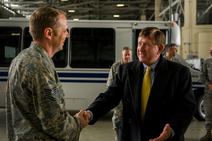 Tech. Sgt. Kevin Long, 437th Maintenance Squadron shift chief, greets Terry Yonkers, Assistant to the Secretary of the Air Force for Installations, Environment and Logistics, during a tour Dec. 13, 2012, at Joint Base Charleston - Air Base, S.C. Yonkers visited JB Charleston to tour various work centers on base and speak with Airmen and Sailors. Yonkers is responsible for providing oversight for all matters pertaining to the formulation, review, and execution of plans, policies, programs, and budgets for installations, energy, environment, safety and occupational health as well as weapon systems logistics support. (U.S. Air Force photo/ Airman 1st Class George Goslin)