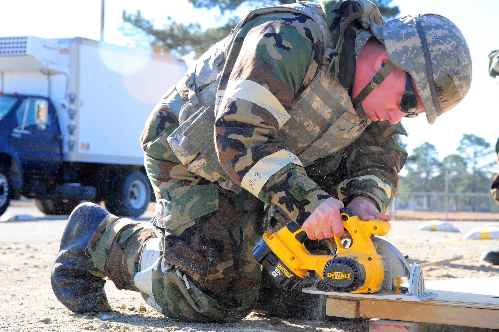 U.S. Air Force Airman 1st Class Byron Haynes, 4th Civil Engineer Squadron structural apprentice, uses a circular saw to cut wood during Operational Readiness Exercise Coronet Warrior 12-06, at a simulated deployed location on Seymour Johnson Air Force Base, N.C., Dec. 19, 2012. Haynes, with the help of several structural apprentices, built confidential legal and religious counseling rooms. (U.S. Air Force photo/Airman 1st Class Aubrey White/Released)