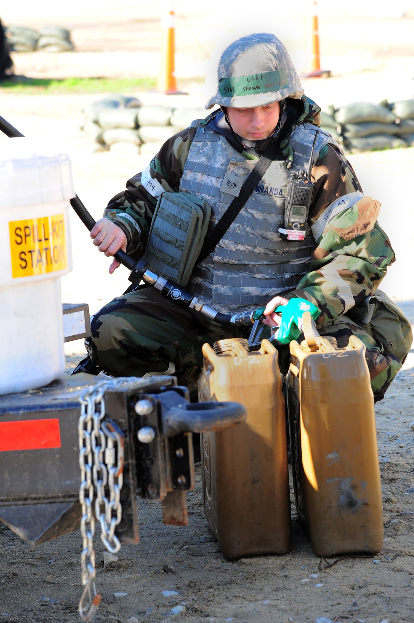 U.S. Air Force Staff Sgt. Shawn Miranda, 4th Logistics Readiness Squadron petroleum, oil and lubricant technician, fills a container with fuel during Operational Readiness Exercise Coronet Warrior 12-06, at a simulated deployed location on Seymour Johnson Air Force Base, N.C., Dec. 19, 2012. The fuel will be used to power generators located in several areas on base. (U.S. Air Force photo/Airman 1st Class Aubrey White/Released)