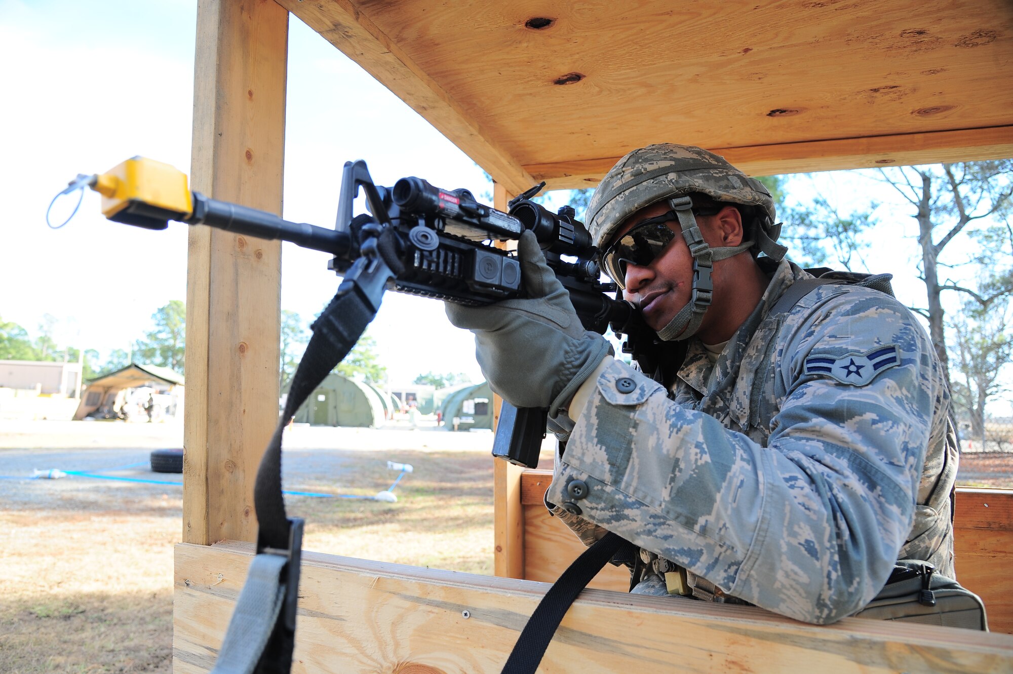 U.S. Air Force Airman 1st Class Michael Mandel, 4th Security Forces Squadron patrolman, scans his area of responsibility during Operational Readiness Exercise Coronet Warrior 12-06, at a simulated deployed location on Seymour Johnson Air Force Base, N.C., Dec. 19, 2012. Security forces personnel stood watch, reported  suspicious activity and defended the base during the ORE. (U.S. Air Force photo/Airman 1st Class Aubrey White/Released)