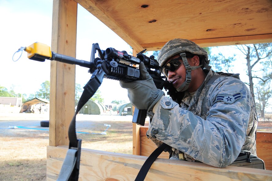U.S. Air Force Airman 1st Class Michael Mandel, 4th Security Forces Squadron patrolman, scans his area of responsibility during Operational Readiness Exercise Coronet Warrior 12-06, at a simulated deployed location on Seymour Johnson Air Force Base, N.C., Dec. 19, 2012. Security forces personnel stood watch, reported  suspicious activity and defended the base during the ORE. (U.S. Air Force photo/Airman 1st Class Aubrey White/Released)