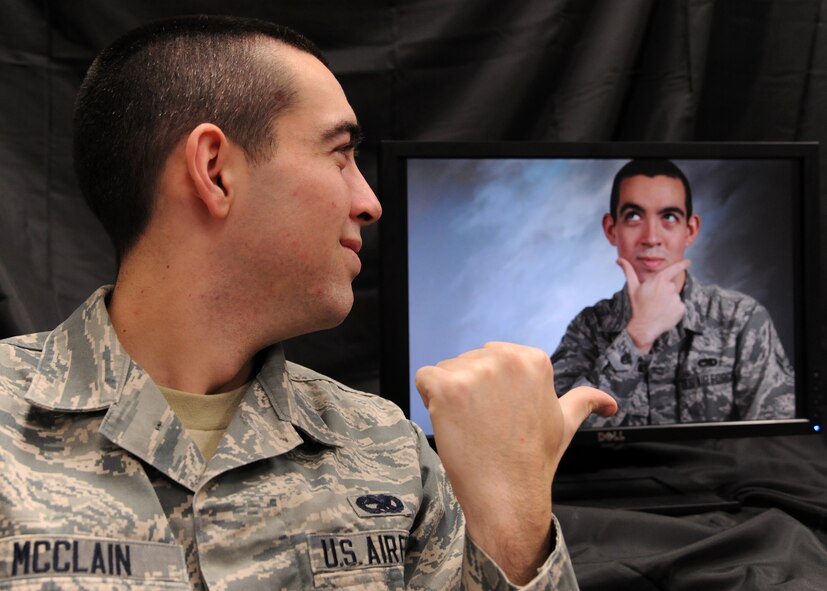 Airman 1st Class Johnathan McClain, 69th Maintenance Squadron, sees double during a photo shoot Dec. 19, 2012, on Grand Forks Air Force Base, N.D. McClain is an aircraft maintenance technician who said his most memorable moment since arriving here six months ago was being involved in the first Global Hawk flight from the base. (U.S. Air Force photo/Airman 1st Class Ashley Taylor)
